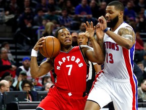 Kyle Lowry of the Toronto Raptors tries to maintain control of the ball next to Marcus Morris of the Detroit Pistons during an NBA game on April 5, 2017 in Auburn Hills, Michigan. (Gregory Shamus/Getty Images)