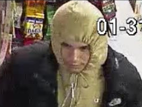 Police are looking for the public's help in identifying a suspect they are calling "the garbage bag bandit." He is described as Male, approximately 25-30 years old, 5-foot-7 to 5-foot-9. (TORONTO POLICE/HANDOUT)