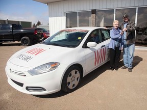 Mamie Sainsbury recieves the keys to her new Dodge Dart from Vermilion Chrysler Mike Matthews on Friday, March 31, 2017, in Vermilion, Alta. Habitat for Humanity Vermilion had the car they had on raffle for the past few months  to pay off the remainder of their 2016 build. Taylor Hermiston/Vermilion Standard/Postmedia Network.