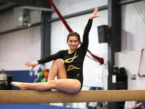 Mackenzie Cortes of Manitoulin Secondary School performs her routine on the beam at the high school gymnastics championships in Sudbury, Ont. on Monday April 3, 2017. Gino Donato/Sudbury Star/Postmedia Network