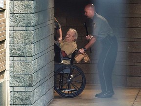 In this April 20, 2015 file photo, Robert Gentile is brought into the federal courthouse in a wheelchair for a hearing in Hartford, Conn. (Cloe Poisson/Hartford Courant via AP, File)