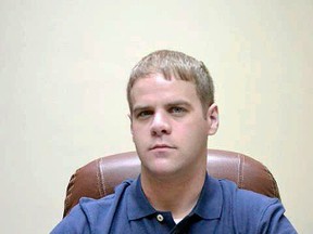 In this undated photo, Mississippi County Sheriff Cory Hutcheson sits behind his desk at the Mississippi County Detention Center in Charleston, Mo. (Leonna Heuring/Standard via AP)