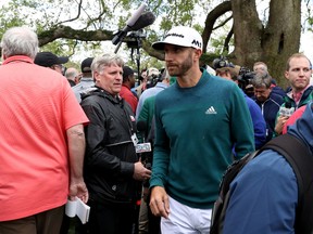 Dustin Johnson of the United States walks off after announcing his withdrawal to the media during the first round of the 2017 Masters Tournament at Augusta National Golf Club on April 6, 2017. (Photo by Rob Carr/Getty Images)