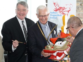 Sudbury Hospice Foundation president and chair Gerry Lougheed Jr. (left), Sudbury Dragon Boat Festival organizing chair Jim Smith and Greater Sudbury Mayor Brian Bigger paint the eyes on a dragon to launch the the 2017 Sudbury Dragon Boat Festival during a press conference at the Northern Water Sports Centre in Sudbury on April 6, 2017. Ben Leeson/The Sudbury Star/Postmedia Network