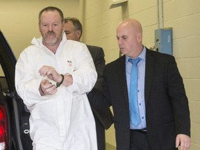 Sylvain Duquette arrives at the courthouse to be charged in connection with a triple murder Thursday, April 6, 2017 in Shawinigan, Que. (THE CANADIAN PRESS)