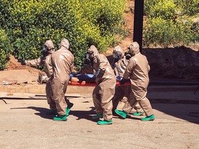 In this photo taken on Tuesday, April 4, 2017 and made available Wednesday, April 5, Turkish experts carry a victim of alleged chemical weapons attacks in Syrian city of Idlib, at a local hospital in Reyhanli, Hatay, Turkey. A suspected chemical attack in a town in Syria's rebel-held northern Idlib province killed dozens of people on Tuesday, opposition activists said, describing the attack as among the worst in the country's six-year civil war.(AP Photo)