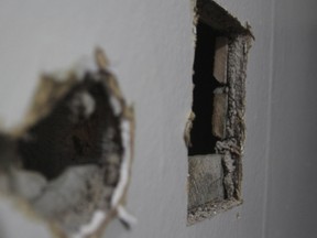 Damage, caused by a 12-gauge slug fired from a man’s single-barrel, bolt-action shotgun on Monday, can be seen in the house at 91 Beverley St. Steph Crosier, Kingston Whig-Standard, Postmedia Network