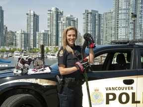 Meghan Agosta stands in front of a Vancouver police car. (Supplied by Meghan Agosta)