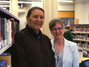 Wilson Bearhead, left, stands with Linda Garvin, executive director of customer experience with the Edmonton Public Library (EPL), at the Stanley A. Milner Library's temporary location at 10212 Jasper Avenue in Edmonton on Monday, April 3, 2017. Bearhead will be named the EPL's first Elder in Residence at a special ceremony on Friday, April 7, 2017. CLAIRE THEOBALD Postmedia