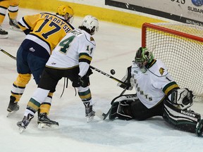 London Knights goalie Tyler Parsons and defenseman London Knight goalie Tyler Parsons and defenseman Brandon Crawley spoil a shot by Taylor Raddysh of the Erie Otters during Game 1 of the second round o the OHL playoffs April 6 at Erie Insurance Arena. [JACK HANRAHAN/ETN]