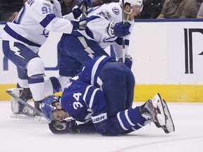 Auston Matthews hurt by a hit as the Toronto Maple Leafs play the Tampa Bay Lightning at the Air Canada Centre in Toronto on April 3, 2017. (Michael Peake/Toronto Sun/Postmedia Network)