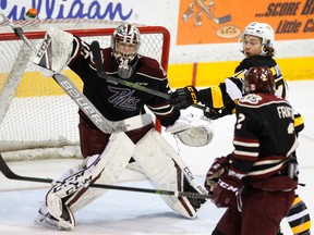 Peterborough Petes' goalie Dylan Wells stops a shot deflected by Kingston Frontenacs' Linus Nyman during the first period of Game 1 of their Ontario Hockey League Eastern Conference semifinal on Thursday April 6, 2017, at the Memorial Centre in Peterborough. (Clifford Skarstedt/Peterborough Examiner/Postmedia Network file photo)