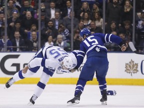 Leafs’ Matt Martin tosses around Tampa Bay’s Braydon Coburn during last night’s game. (MICHAEL PEAKE/Toronto Sun)
