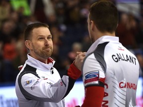 Canadian skip Brad Gushue and second Brett Gallant congratulate each other after defeating Norway 8 - 4 during day six of the World Men's Curling Championship at Northlands Coliseum in Edmonton, Thursday, April 6, 2017.