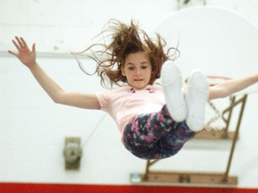 Ally Roebuck is high in the air, as she gets ready to be caught by her Chatham Phoenix Cheer teammates on Monday, March 20. The cheer-leading group has been in Wallaceburg since the beginning of the year and trains out of the former D.A. Gordon elementary school gymnasium.