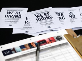 In this Tuesday, Oct. 6, 2015, file photo, job applications and information for the Gap Factory Store sit on a table during a job fair at Dolphin Mall in Miami.  (AP Photo/Wilfredo Lee, File)