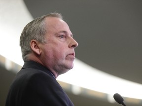 Edmonton Eskimos President and CEO Len Rhodes speaks to media at a press conference announcing that the football club has fired General Manager Ed Hervey. David Bloom/Postmedia