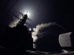 In this image released by the U.S. Navy, the guided-missile destroyer USS Porter conducts strike operations while in the Mediterranean Sea, April 7, 2017. (FORD WILLIAMS/Getty Images)