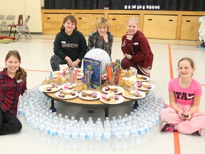 BRUCE BELL/THE INTELLIGENCER
All 261 students at St. Gregory Catholic School in Picton took part in the World of 261 assembly at the school Friday afternoon. The assembly examined how the world's resources are divided. Pictured are continent leaders (from left) Payton Blakely-Haennel (Europe), Gabby Kinnear (South America), Lillian Hepburn (Africa), Sarah Haeneel (North America) and Nadia Bilodeau (Asia).