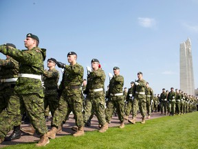Canadian soldiers practice marching at the WWI Canadian National Vimy Memorial in Givenchy-en-Gohelle, France on Friday, April 7, 2017. Commemoration ceremonies will take place on Sunday at the memorial to honor Canadian soldiers who were killed or wounded during the Battle of Vimy Ridge in April 1917. (AP Photo/Virginia Mayo)