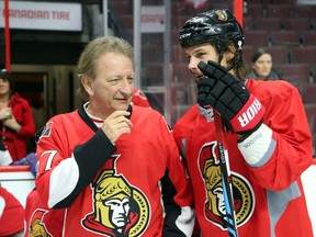 Eugene Melnyk and Erik Karlsson chat during the Eugene Melnyk Skate for Kids event at Canadian Tire Centre in Ottawa on Dec. 16, 2016. (Jean Levac/Postmedia)