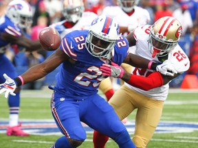 Buffalo Bills running back LeSean McCoy loses the ball momentarily as he is hit by San Francisco 49ers cornerback Tramaine Brock during the second half of an NFL football game on Oct. 16, 2016. (AP Photo/Jeffrey T. Barnes)