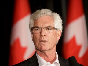 Minister of Natural Resources Jim Carr speaks with media during the federal Liberal cabinet retreat at the Fairmont Palliser in Calgary, Alta., on Tuesday, Jan. 24, 2017. (Lyle Aspinall/Postmedia Network)