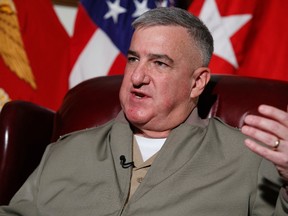 Assistant Commandant of the Marine Corps Gen. Glenn Walters speaks during an interview, Friday, April 7, 2017, at the Pentagon. Two male Marines have been demoted and about two dozen other military members are being investigated in connection with the investigation into nude photographs that were shared online, the Marine Corps said Friday. (AP Photo/Evan Vucci)