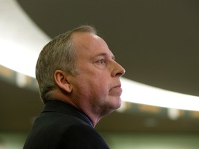 Edmonton Eskimos president and CEO Len Rhodes announces the dismissal of general manager Ed Hervey during a press conference at Commonwealth Stadium in Edmonton on Friday, April 7, 2017. (David Bloom)