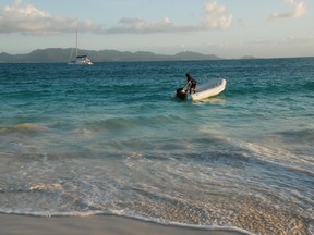 The TradeWinds catamaran JimJams, moored off the coast of Anguilla, awaits the return of guests ferried by dinghy for cocktails and some fun exploration. (BARBARA TAYLOR, The London Free Press)