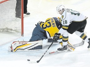Erie Otters goaltender Troy Timpano makes a save on Liam Foudy of the London Knights during Game 2 of their OHL Western Conference semifinal Friday at Erie Insurance Arena in Erie, Pa. (JACK HANRAHAN/Erie Times-News )