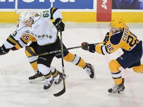 Cliff Pu of the London Knights tries to split T.J Fergus (25) and Anthony Cirelli (22) of the Erie Otters in Game 2 of the second round of the OHL playoffs April 7 at Erie Insurance Arena. (JACK HANRAHAN/ETN)