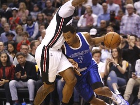 Raptors guard Kyle Lowry walks the line against Heat's James Johnson as Toronto took on Miami on April 7, 2017. (Michael Peake/Toronto Sun/Postmedia Network)