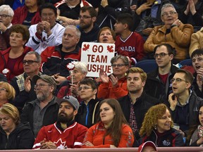 Fans watch Team Canada and Sweden in the 1-2 page playoff draw of the World Men's Curling Championship at Northlands Coliseum in Edmonton on Friday, April 7, 2017. (Ed Kaiser)
