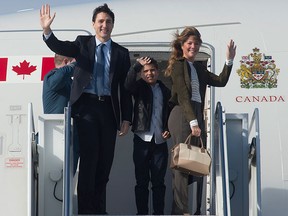 Prime Minister Justin Trudeau, his wife Sophie Trudeau and son Xavier board a government plane in Ottawa, Saturday April 8, 2017. The prime minister and his family are heading to France to commemorate the 100th anniversary of the Battle of Vimy Ridge. THE CANADIAN PRESS/Adrian Wyld