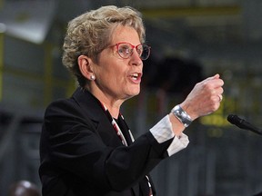 Ontario Premier Kathleen Wynne speaks at the Ford Essex Engine Plant in Windsor, Ont. on Thursday, March 30, 2017. THE CANADIAN PRESS/Dave Chidley