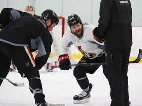 Chris Neil and Zack Smith of the Ottawa Senators practice taking faceoffs during morning practice at the Bell Sensplex in Ottawa on March 27, 2017. (Jean Levac/Postmedia Network)