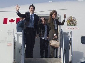 Canadian Prime Minister Justin Trudeau and his wife Sophie Gregoire Trudeau and son Xavier board a government plane in Ottawa, Saturday April 8, 2017. Trudeau and his wife are heading to France to commemorate the 100th anniversary of the Battle of Vimy Ridge.THE CANADIAN PRESS/Adrian Wyld