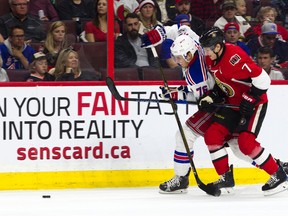 New York Rangers defenceman Brady Skjei and Ottawa Senators forward Kyle Turris battle for the puck during the third period at Canadian Tire Centre on April 8, 2017. (Ashley Fraser/Postmedia)