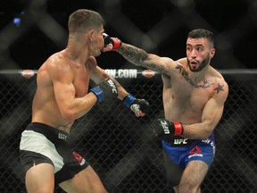 Featherweight Shane Burgos lands a clean shot on Charles Rosa during a mixed martial arts bout at UFC 210, in Buffalo, N.Y. last night. (AP)