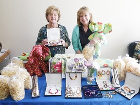 Caruso Club ladies auxiliary members Luisa Cecchetto and Eveleen Cooper show off some items that will be available at the Palm Sunday Tea in Sudbury. The Palm Sunday Tea takes place Sunday from noon to 3 p.m. at the Caruso Club upper hall. There will be many items available from sewing to baking, a penny table, books, a white elephant table and much more. Admission is $5 for adults and $2 for children.