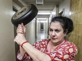 Teresa Da Silva guards the main floor hallway at 155 Sherbourne St. (CRAIG ROBERTSON, Toronto Sun)
