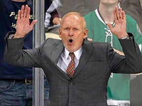 Dallas Stars coach Lindy Ruff shows his displeasure with a call gainst the Pittsburgh Penguins in Pittsburgh, Thursday, Oct. 16, 2014. (AP Photo/Gene J. Puskar)