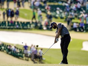 Adam Hadwin hits a shot on the first hole during the final round of the Masters Sunday, April 9, 2017, in Augusta, Ga. (AP Photo/Chris Carlson)