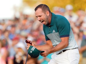 Sergio Garcia reacts after making his birdie putt on the 18th green to win the Masters golf tournament after a playoff Sunday, April 9, 2017, in Augusta, Ga. (AP Photo/Matt Slocum)