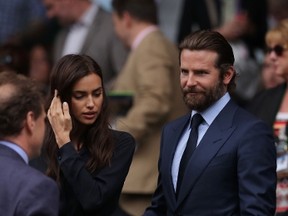 Actor Bradley Cooper and Russian model Irina Shayk arrive for the men's singles final match on the last day of the 2016 Wimbledon Championships at The All England Lawn Tennis Club in Wimbledon, southwest London, on July 10, 2016. (ANDREW COULDRIDGE/AFP/Getty Images)