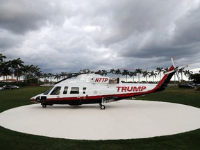 A personal helicopter of President Donald Trump sits on the helipad at Mar-a-Lago, Sunday, April 9, 2017, in Palm Beach, Fla. The helicopter appeared Sunday on the newly paved helipad of Mar-a-Lago, then left a few hours later. The White House didn't respond to questions about the reason the helicopter was there. (AP Photo/Alex Brandon)