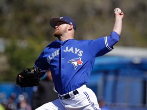 Toronto Blue Jays' JP Howell pitches against the New York Yankees in the sixth inning of a spring training baseball game, Thursday, March 16, 2017, in Dunedin, Fla. Left-handed pitcher Howell was placed on 10-day disabled list by the Toronto Blue Jays on April 9, 2017, with a left shoulder strain.(JOHN RAOUX/AP files)