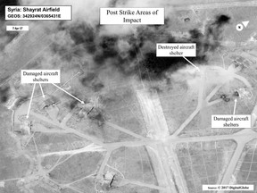 This satellite photo courtesy of the Department of Defense shows a battle damage assessment image of Shayrat Airfield, Syria, following US Tomahawk Land Attack Missile strikes on April 7, 2017 from the USS Ross (DDG 71) and USS Porter (DDG 78), Arleigh Burke-classguided-missile destroyers. The United States fired Tomahawk missiles into Syria in retaliation for the regime of Bashar Assad using nerve agents to attack his own people. (AFP PHOTO / DoD / Handout)