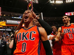 Oklahoma City Thunder guard Russell Westbrook celebrates after hitting a buzzer beater 3-pointer to win the NBA basketball game against the Denver Nuggets, Sunday, April 9, 2017, in Denver. Oklahoma City beat Denver 106-105. Westbrook also broke the NBA record for triple doubles with 42. (AP Photo/Jack Dempsey)